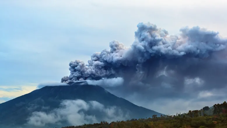 Mount Agung volcano erupting with a huge plume of volcanic ash cloud.