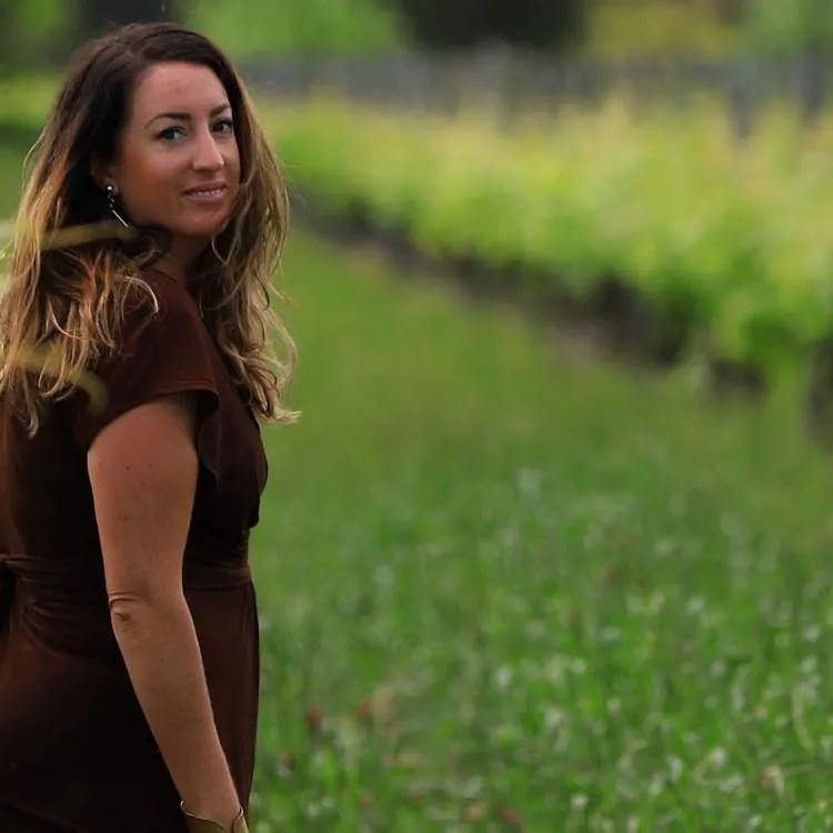 Coral Stanley-Joblin stands in front of a natural environment.